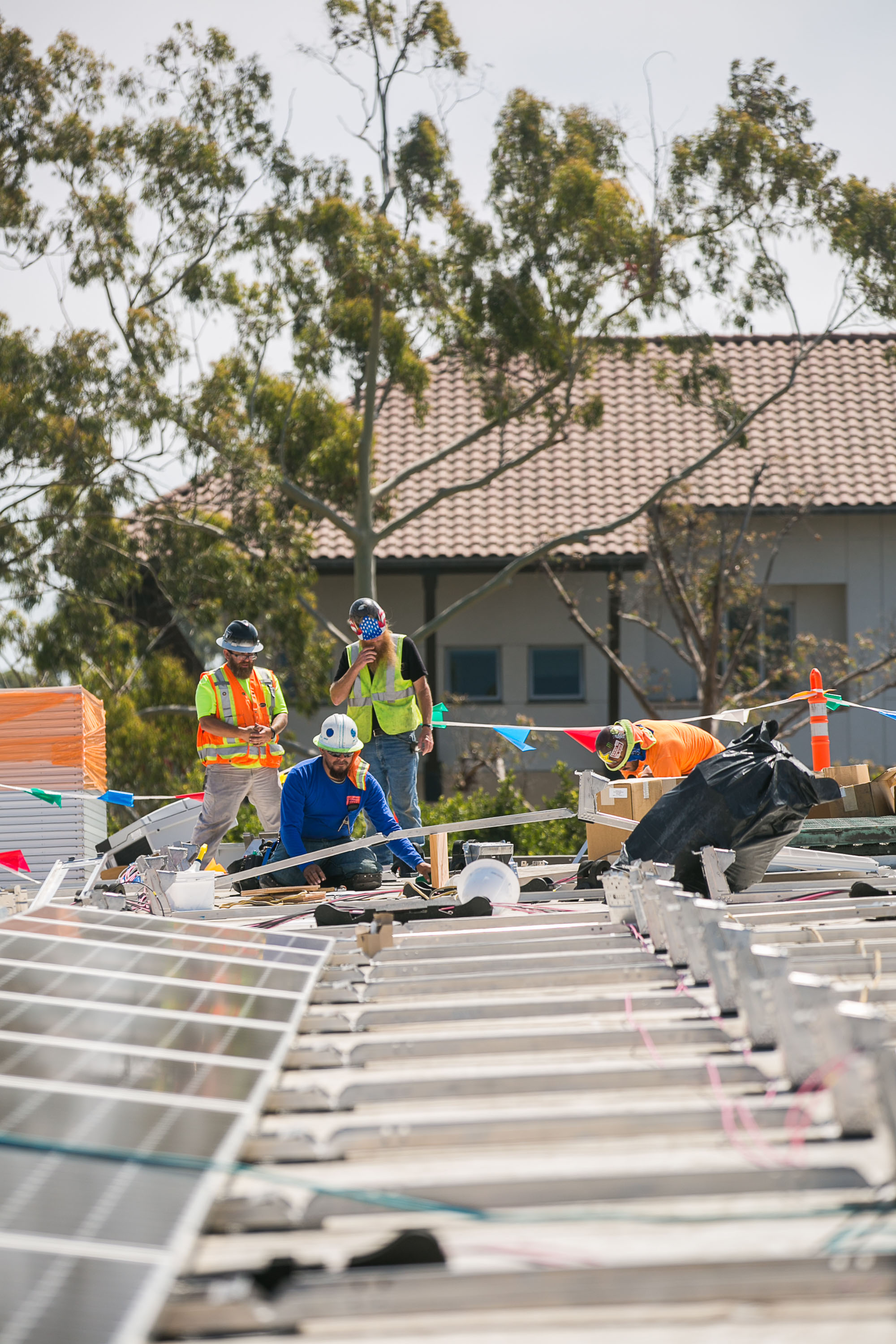 people installing solar panels