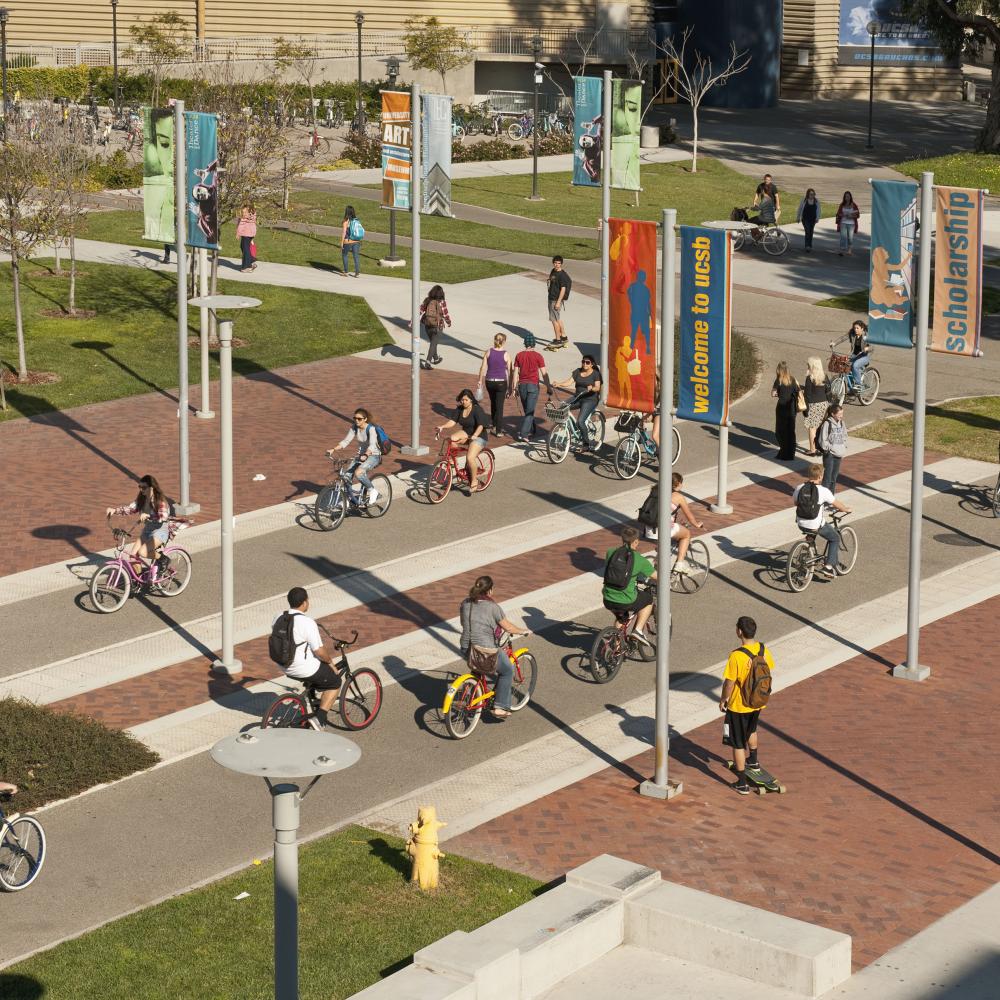 Aerial view of students riding bikes on campus